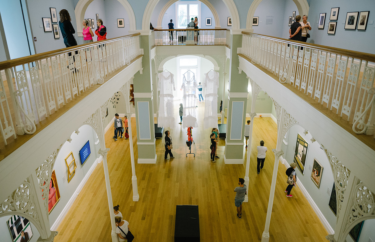 <p>Visitors in the historic Grey Gallery</p>
